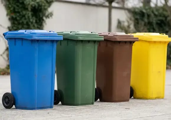 Different colored trash bins for separating trash